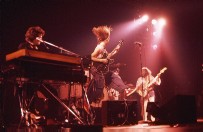 Max on stage with Kim leaping. (June '77)